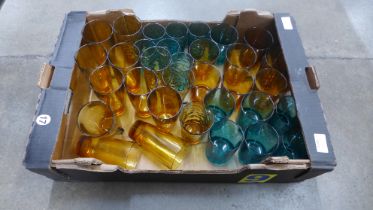 A box of coloured drinking glasses, five different sets, odd numbers, including French **PLEASE NOTE