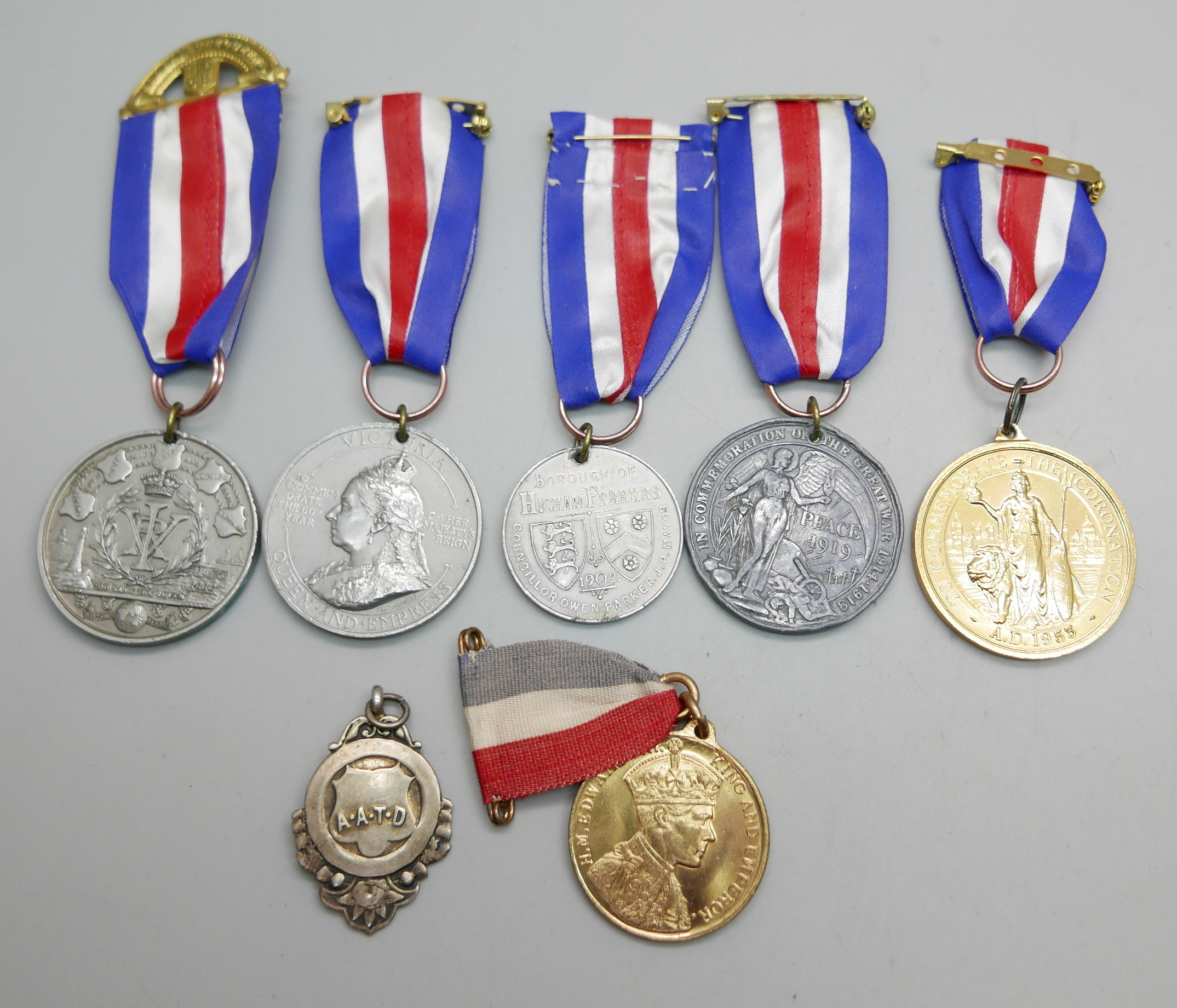 Six early 20th Century commemorative medallions and a silver fob medal