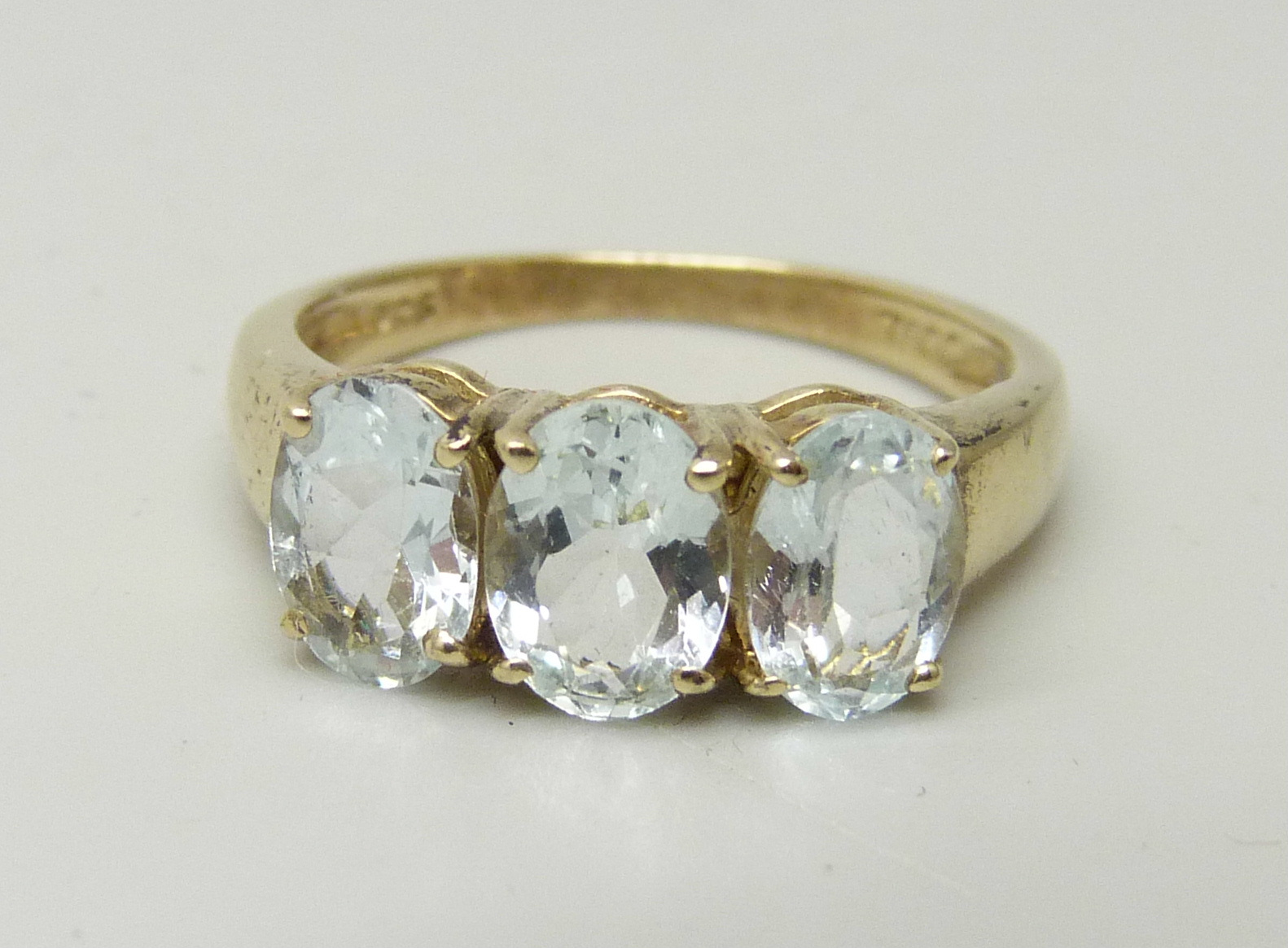 A silver gilt rock crystal trilogy ring, L