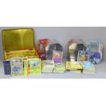 A large quantity of Pokemon cards in collectors tins