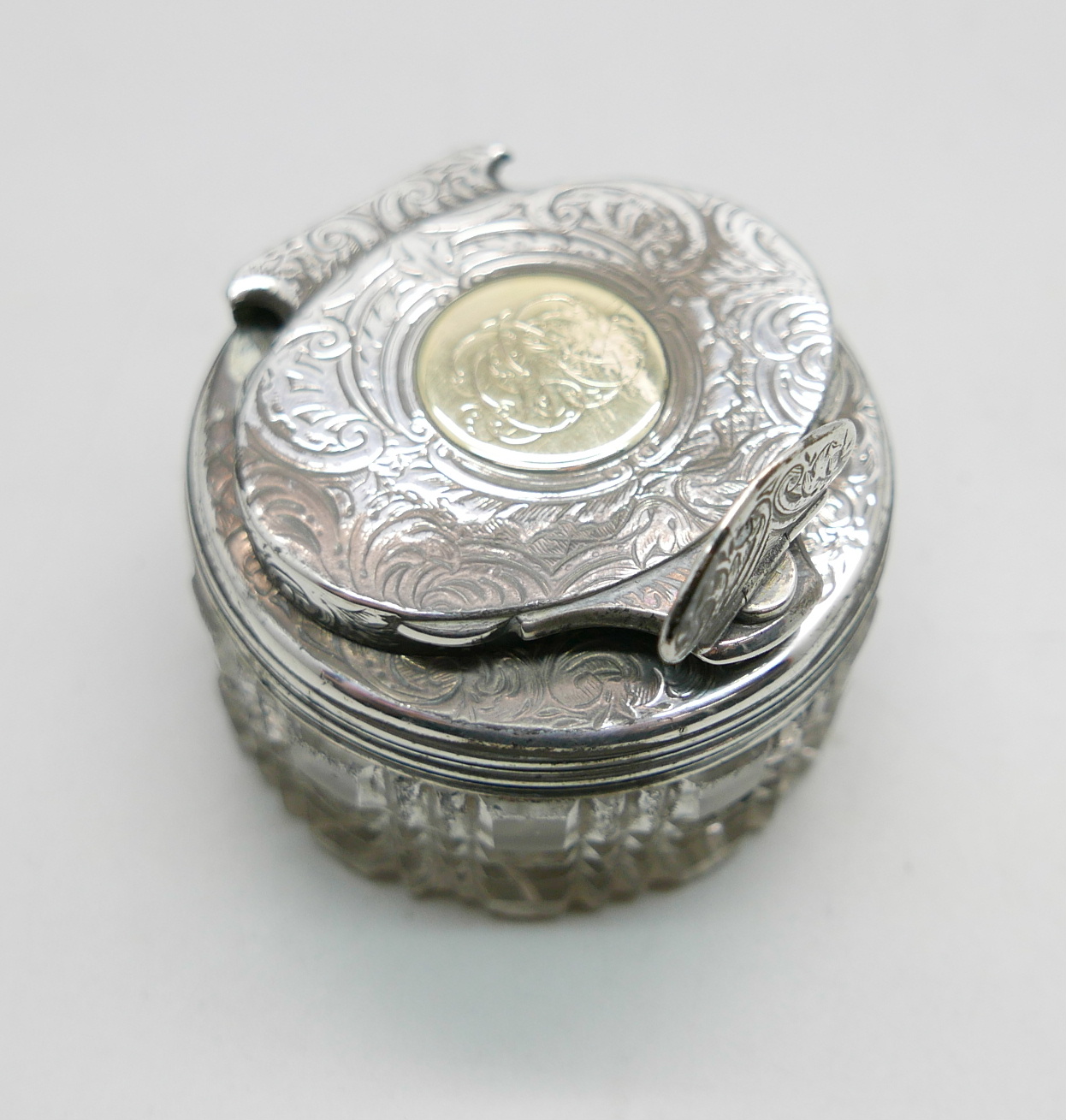 A Victorian silver topped glass travelling ink well