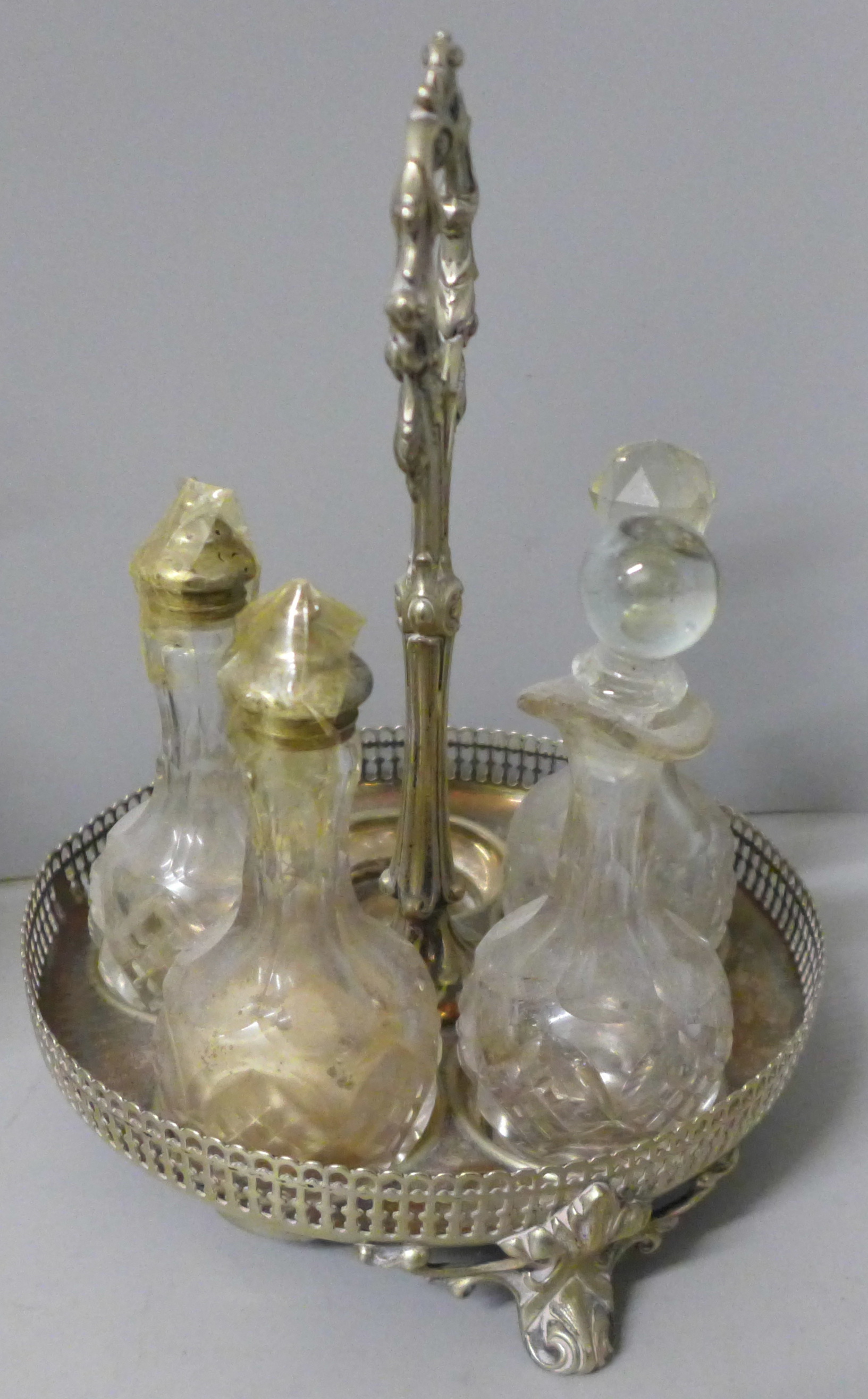 Two plated cruet sets, one six bottle with missing glass bottle and an ornate six bottle cruet set - Image 2 of 3