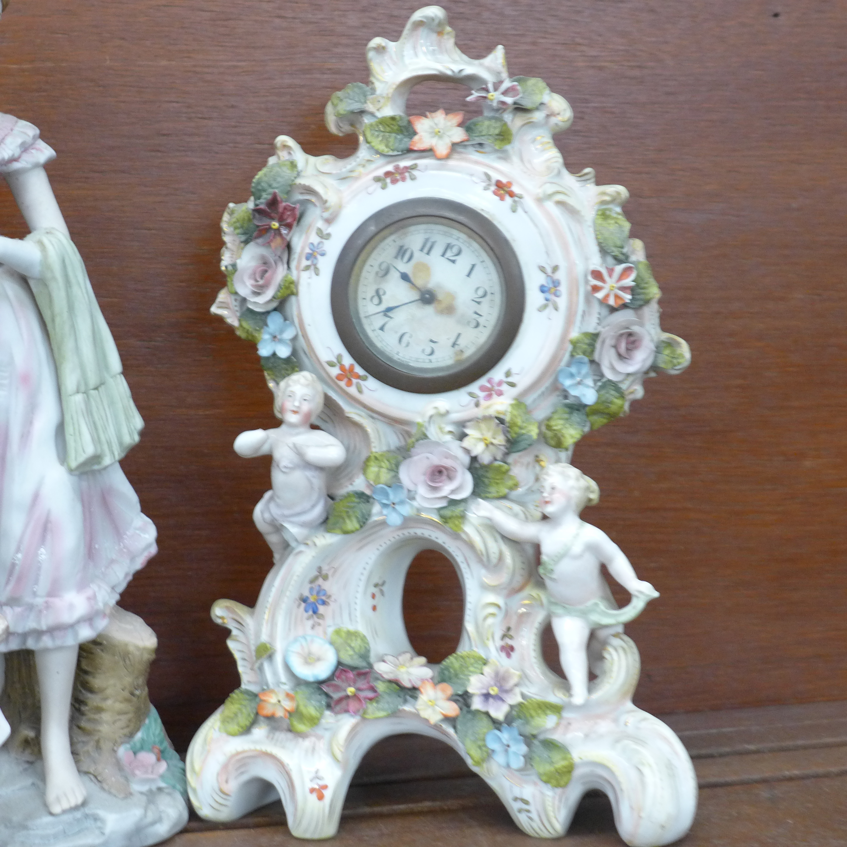 A cherub porcelain mantel clock, a hand painted porcelain ceramic Johnny Appleseed figure, hand - Image 3 of 3