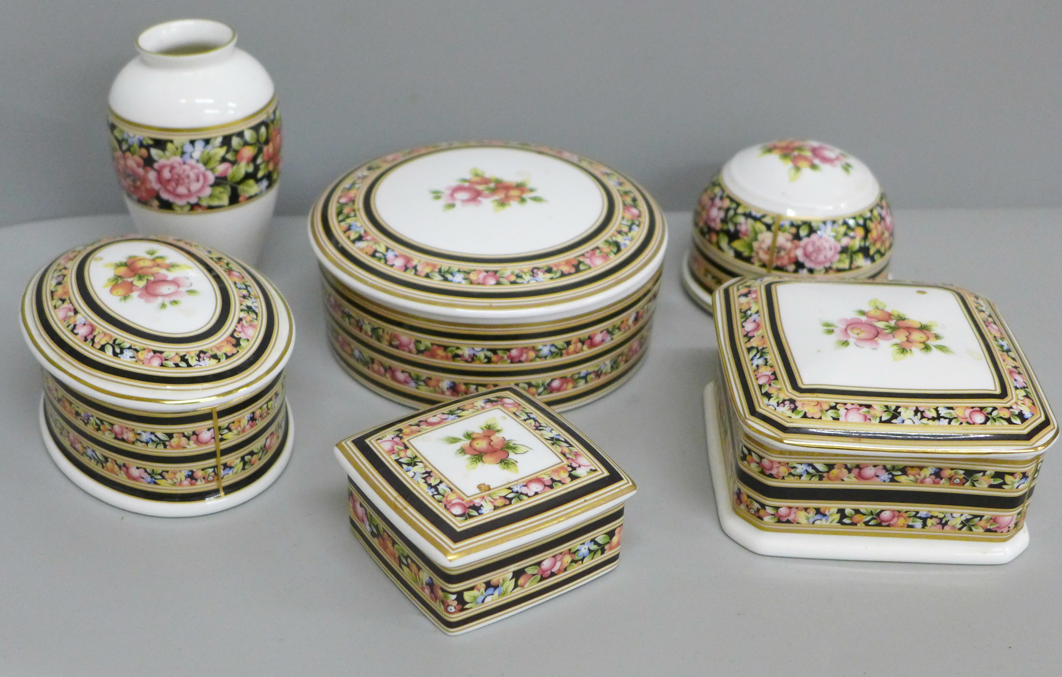 Four Wedgwood Clio lidded pots, paperweight and vase
