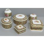 Four Wedgwood Clio lidded pots, paperweight and vase