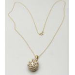 A 9ct gold and diamond set pendant, 2g, and chain