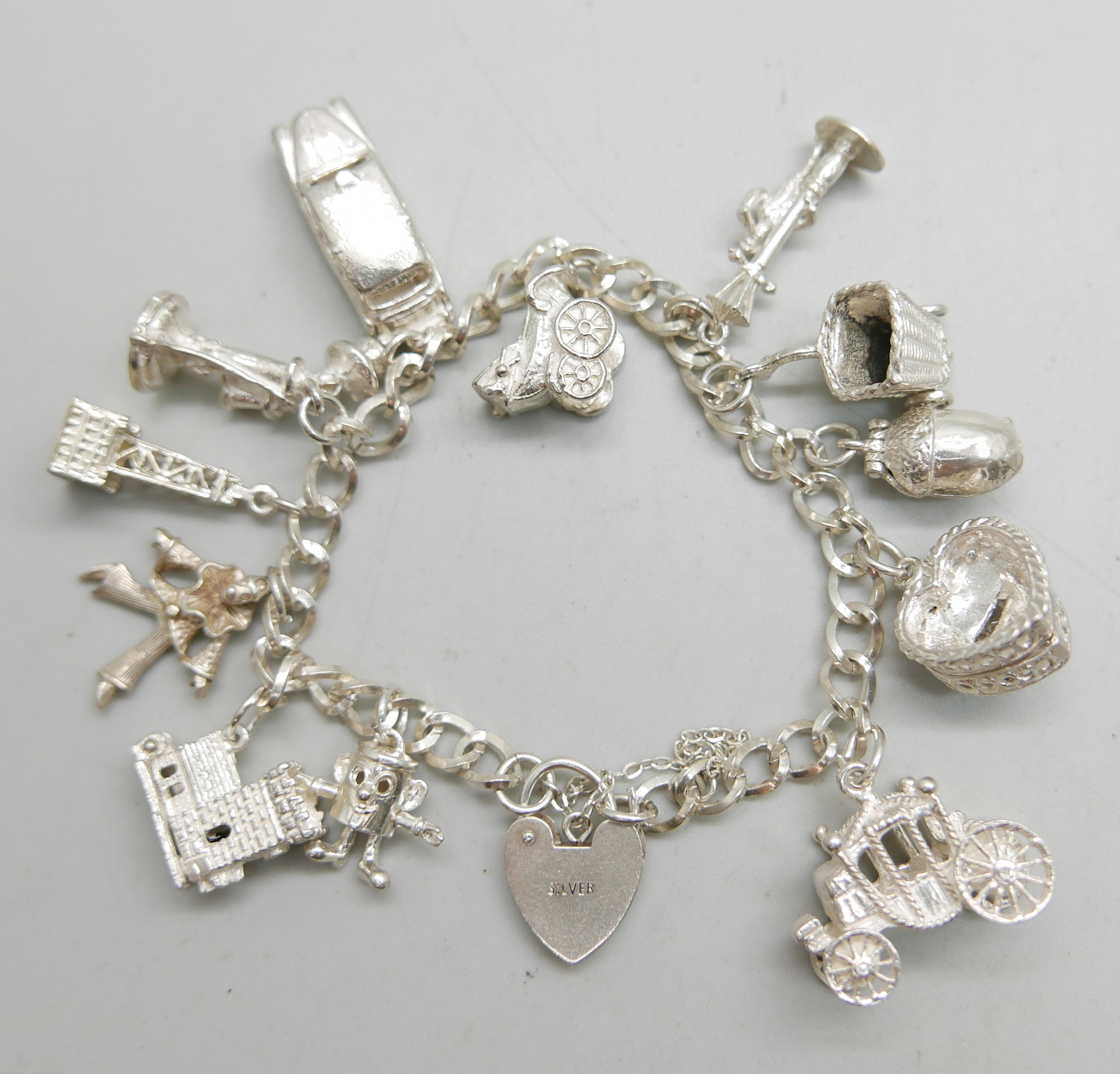 A silver charm bracelet, 50g