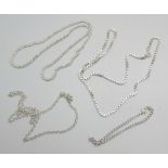 Three silver neck chains and a silver bracelet, 40g