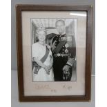 A Queen Elizabeth II and Prince Philip black and white photograph with a leather frame, 1993