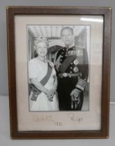 A Queen Elizabeth II and Prince Philip black and white photograph with a leather frame, 1993