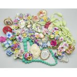 A collection of floral themed jewellery, two Limoges pieces, one vintage blue necklace, Denton china