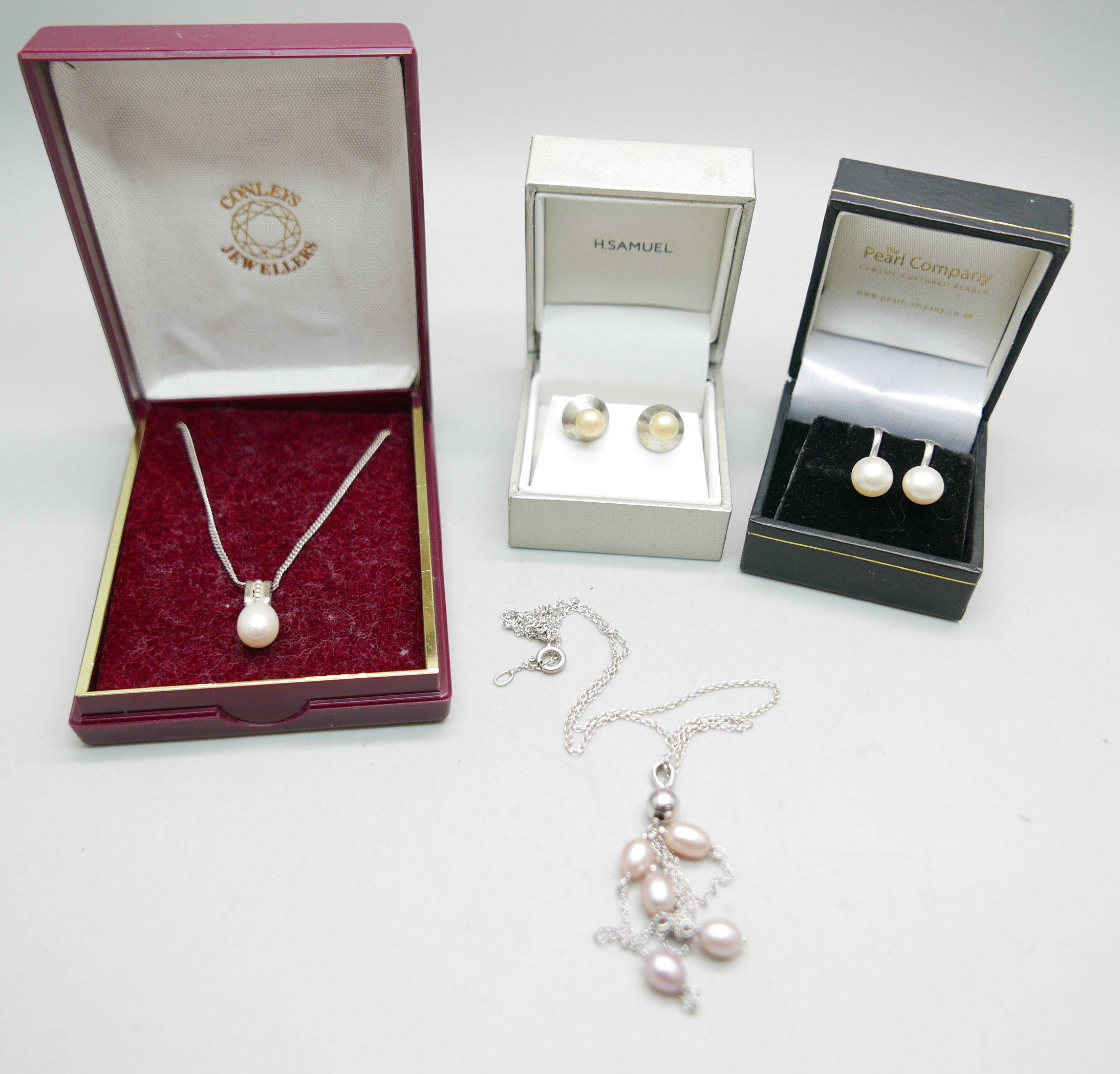 Two silver and cultured pearl necklaces and two pairs of cultured pearl earrings