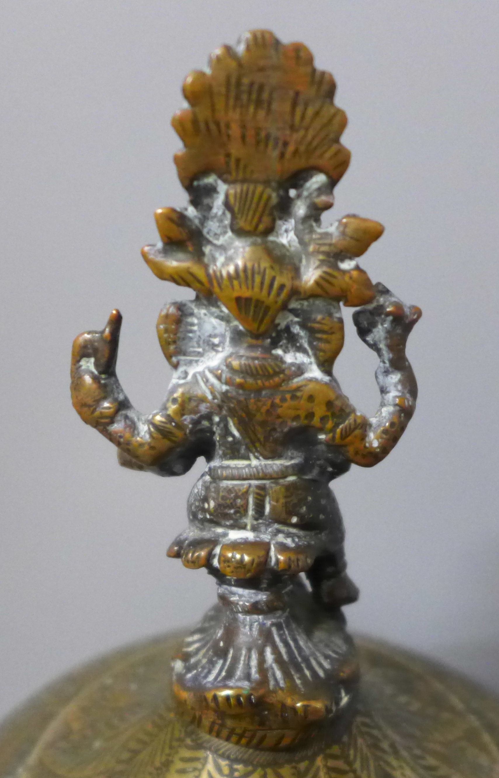 A chase engraved brass Indian lidded caddy with Ganesha top detail, 33cm and a leather powder case - Image 3 of 4