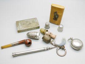 A propelling pencil, tests as silver, a silver mounted miniature pipe, two silver thimbles (one