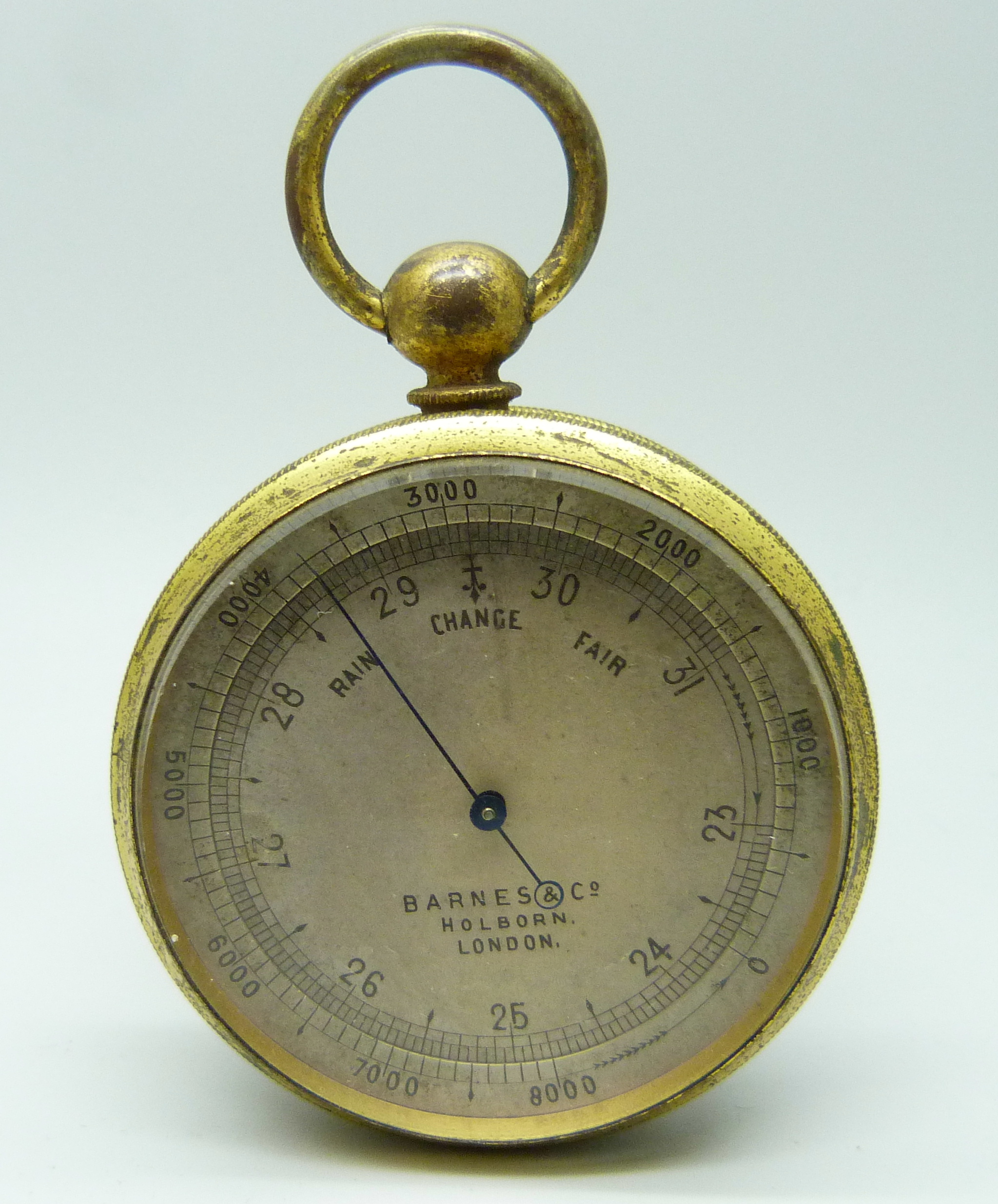 An Edwardian brass cased barometer by Barnes & Co., Holborn, London