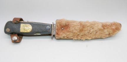 A German Decora, Solingen hunting knife with multitools in hilt, in leather sheath