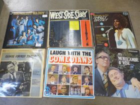 A collection of 35 LP records; West Side Story, Bond Movies Soundtrack, Top of The Pops, etc.