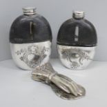 Two similar hip flasks, leather, glass and silver plated cups and a paper clip in the form of a hand