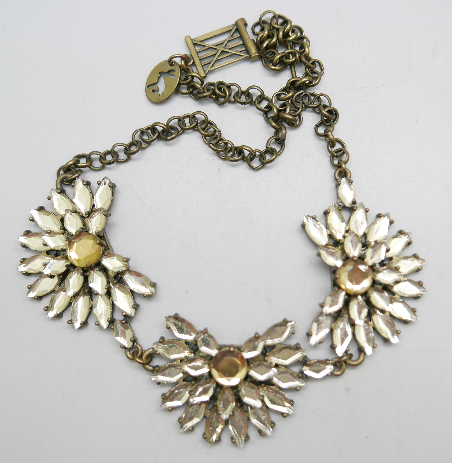 A Butler and Wilson Purple and Gold necklace and a Joules rhinestone three flower necklace - Image 3 of 3