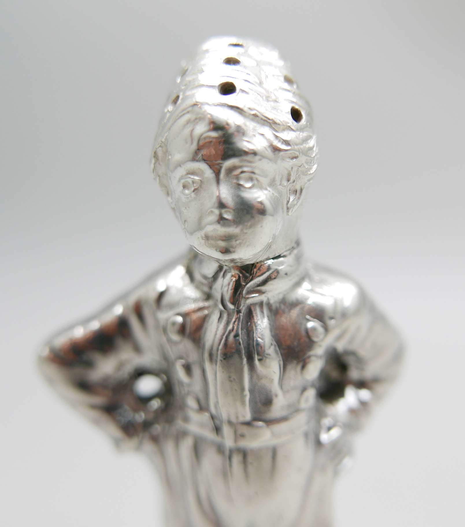 A novelty continental silver pepper modelled as a young Dutch boy, marked HH, possibly Herbert - Image 3 of 5