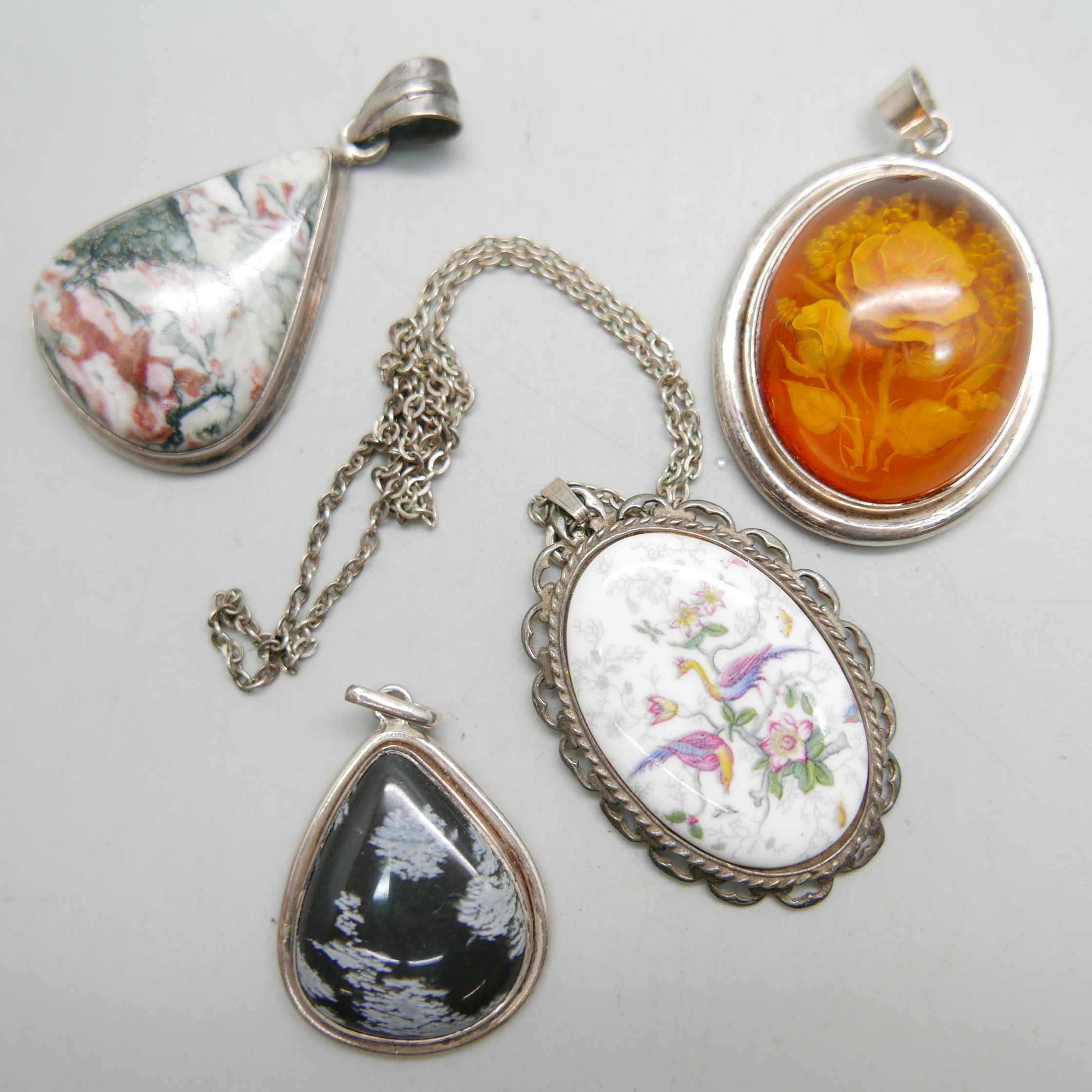 A hallmarked silver Coalport plaque pendant, a silver and amber coloured pendant, and two other - Image 2 of 2