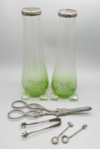 Two silver topped glass bud vases, London 1911, grape scissors, a pair of small silver claw sugar
