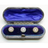 Three yellow metal studs, each set with an opal, cased, (rear of one a/f), 3.3g