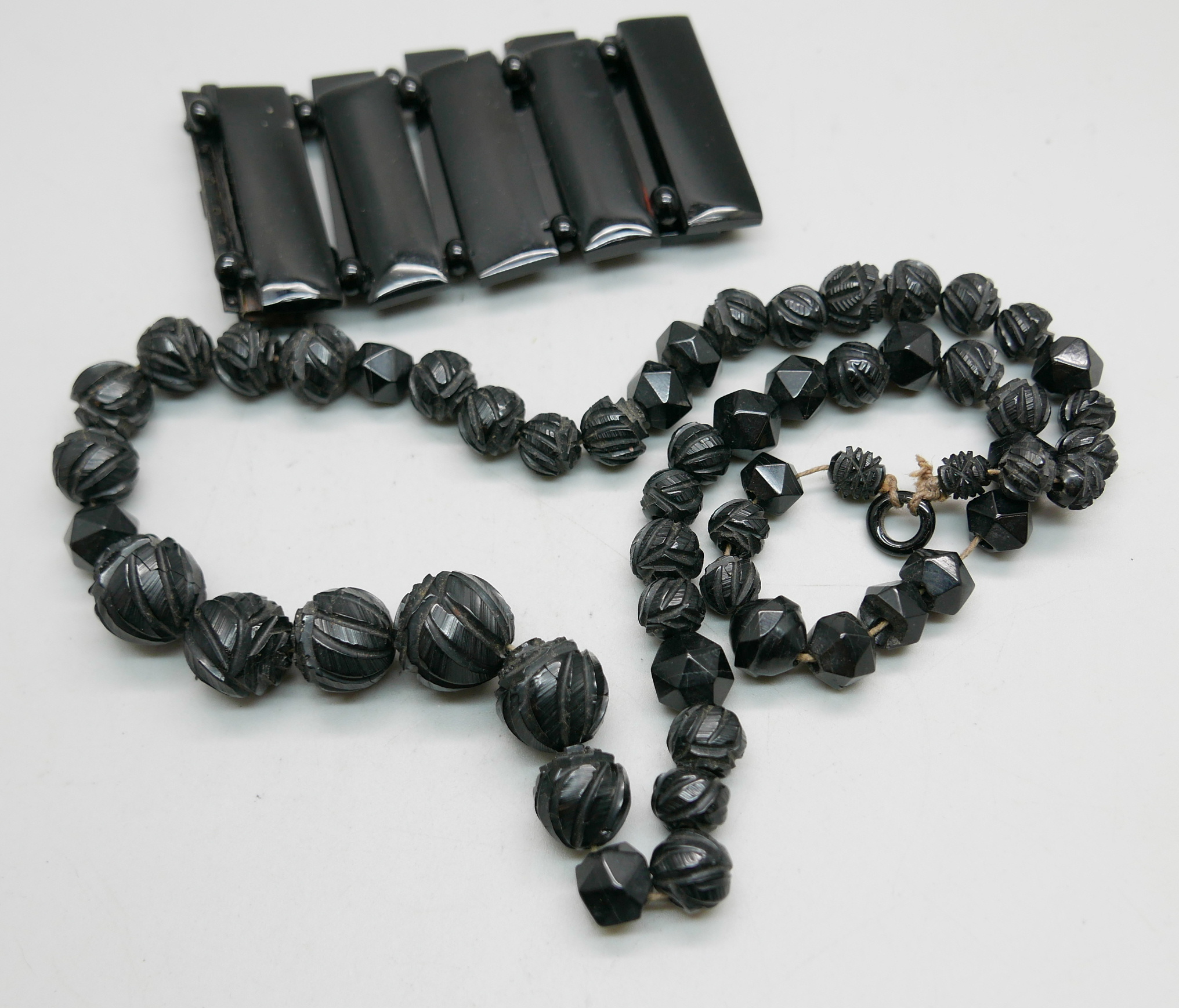 A carved jet necklace and bracelet