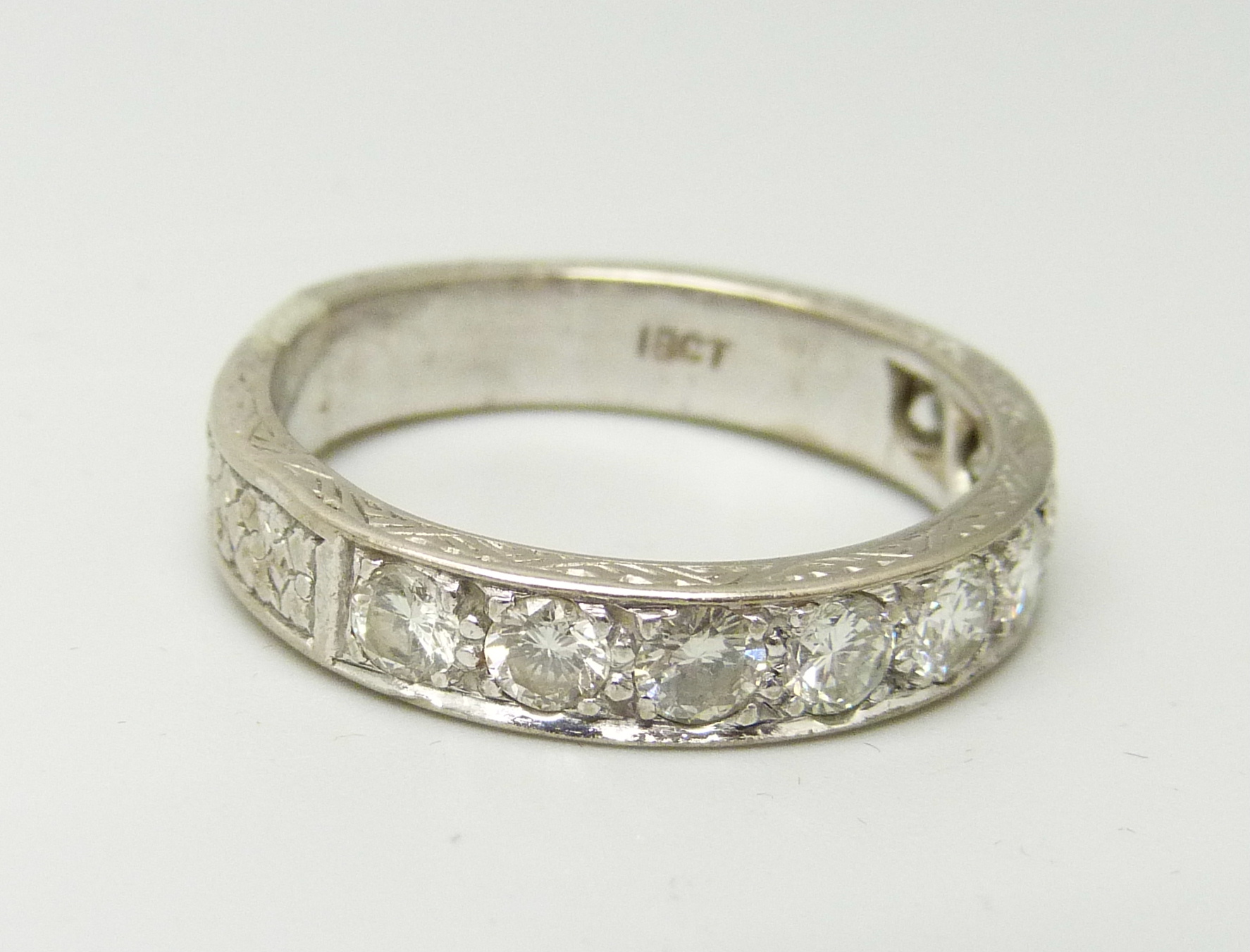 An 18ct gold and diamond half-eternity ring, approximately 1.40ct diamond weight, 7.2g, T