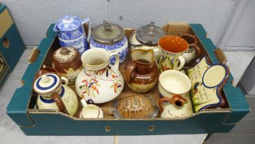 A Royal Doulton tobacco jar and cover, a Doulton Lambeth relief moulded jug, Doulton Burslem biscuit