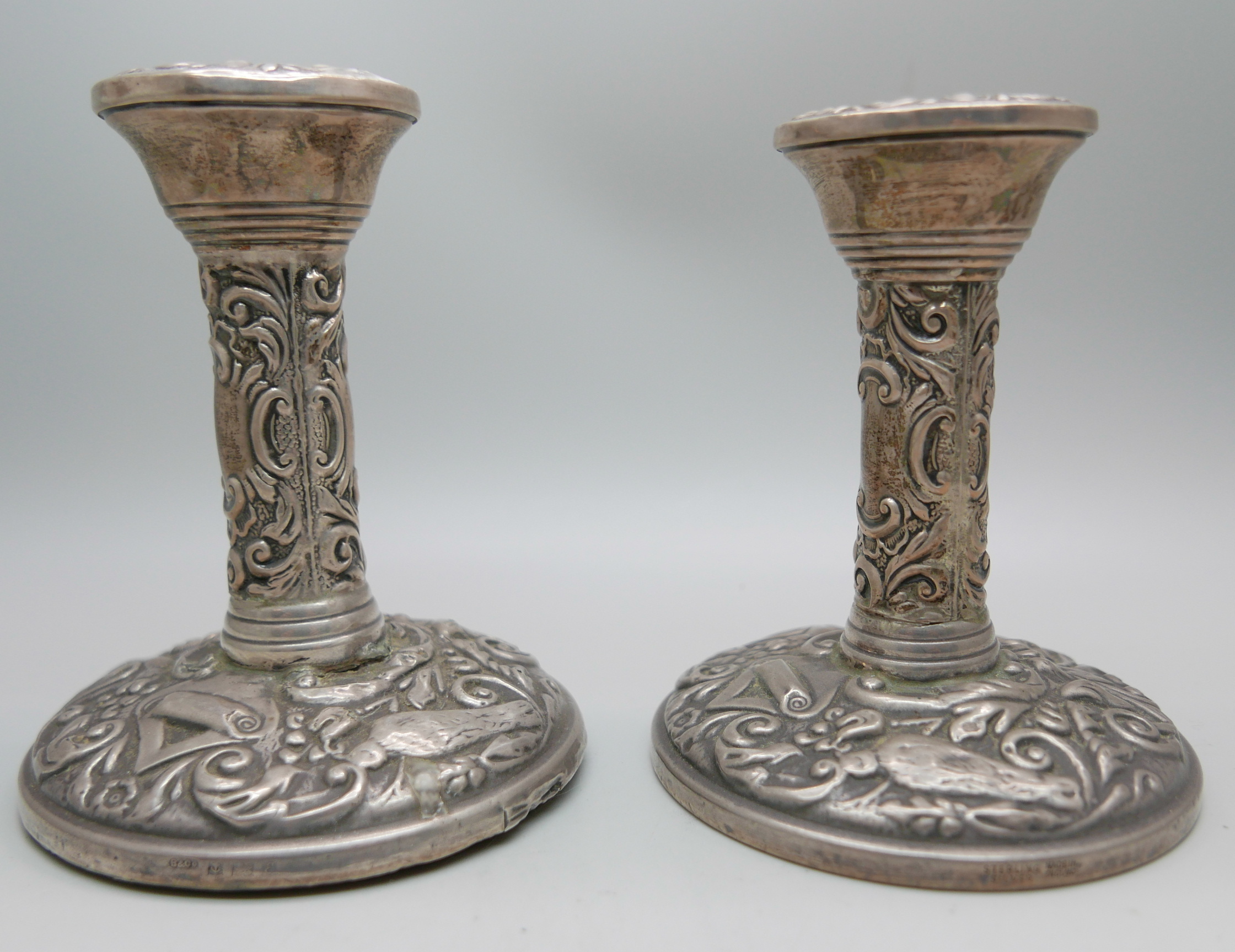 A pair of silver embossed candlesticks, W. I. Broadway & Co., Birmingham 1953/54, 10cm - Image 2 of 7