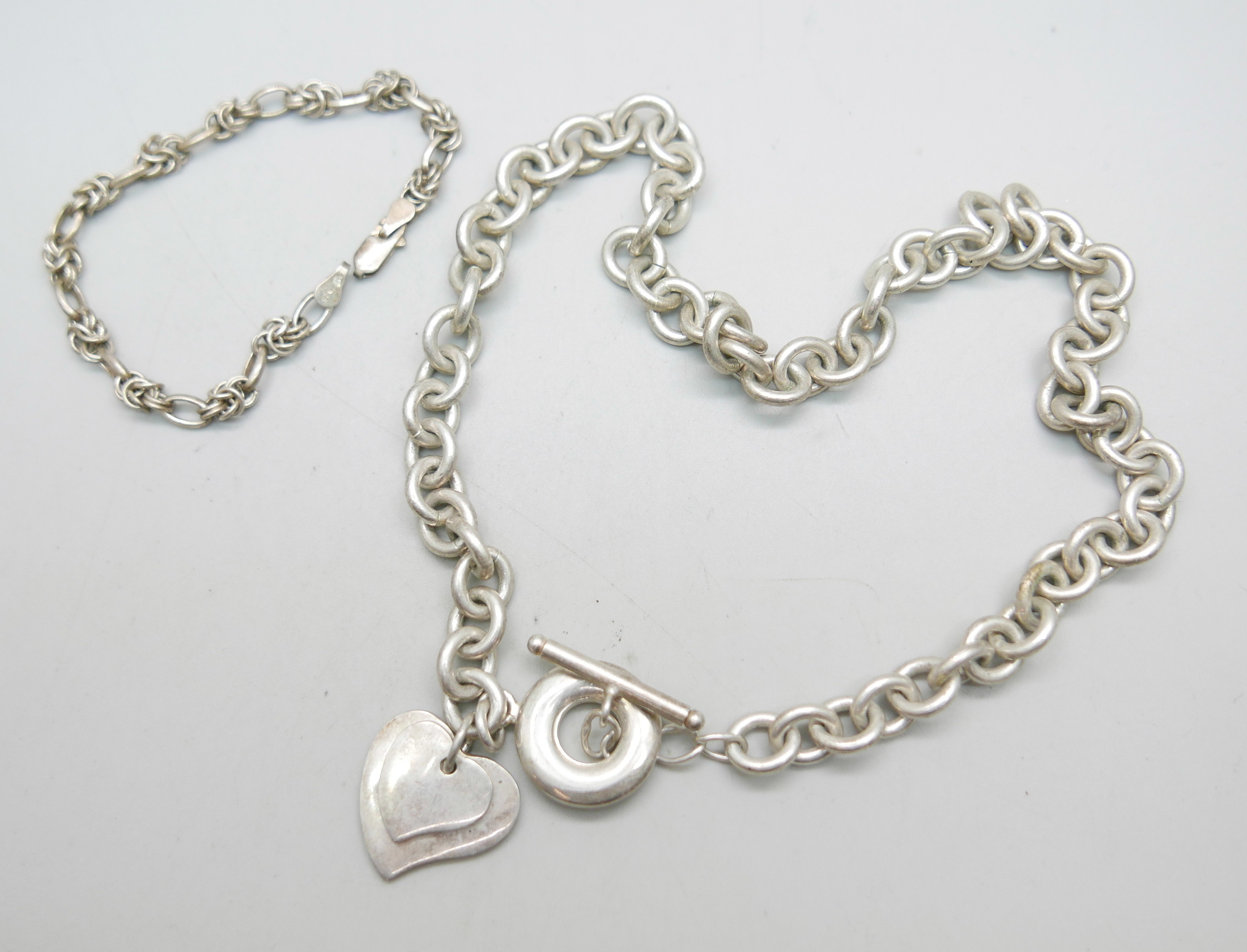 A silver heart, T-bar necklace and a silver bracelet, 77g