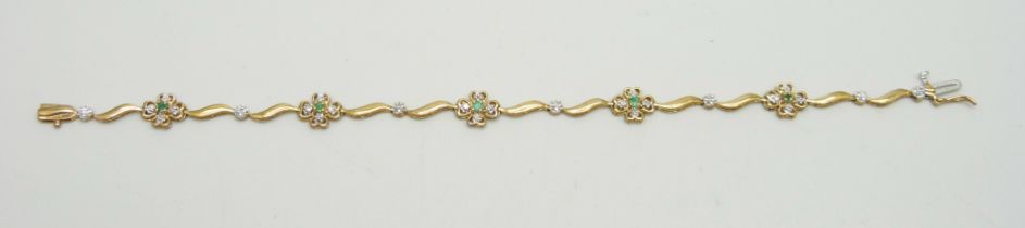A 9ct gold, diamond and emerald bracelet, 5.5g