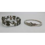 One vintage eastern inspired silver bangle with temples, elephants, etc., and a silver cable