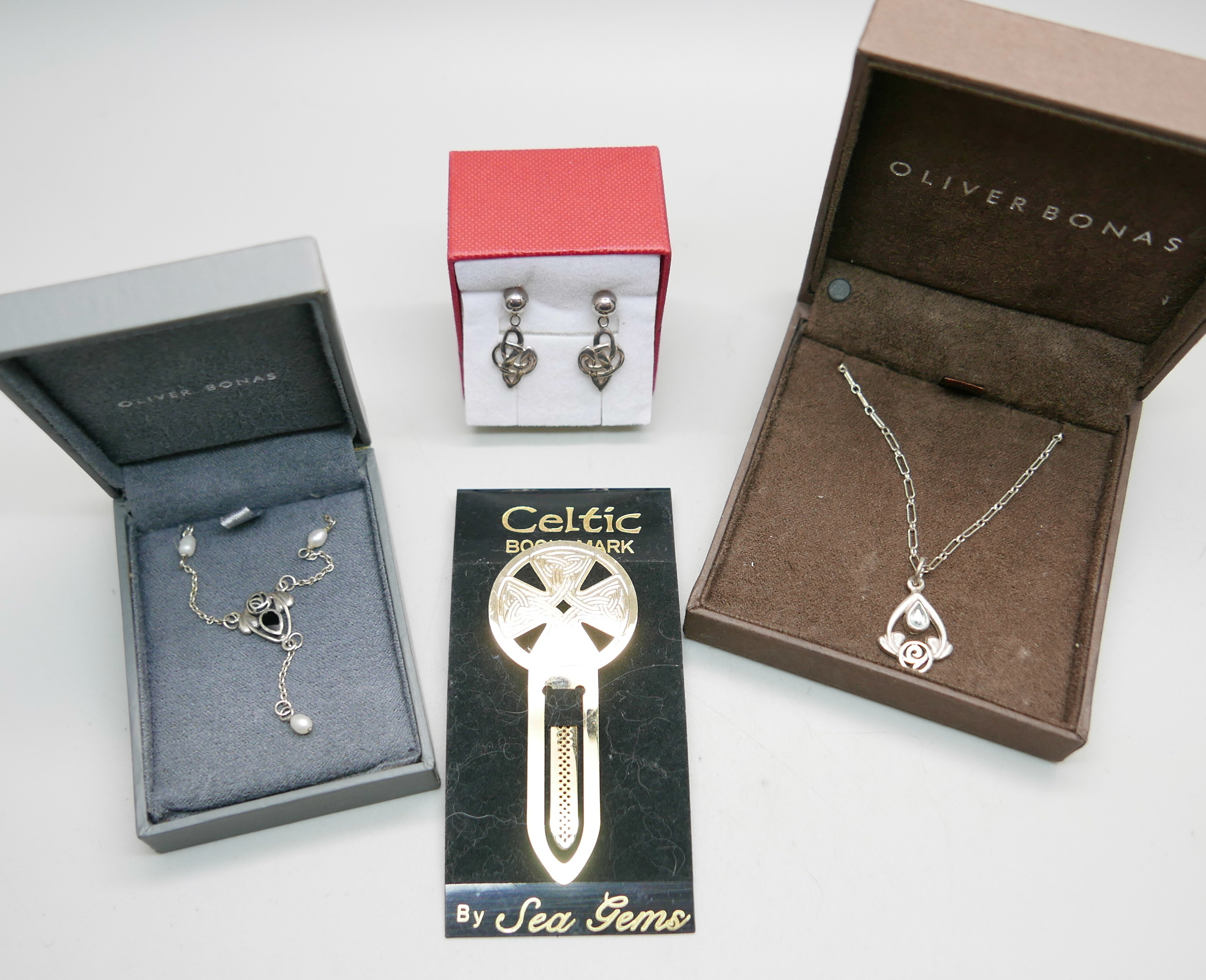 Two silver Celtic necklaces, earrings and a Sea Gems bookmark