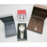Two silver Celtic necklaces, earrings and a Sea Gems bookmark