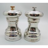 A silver salt and and a silver pepper by Roberts & Dore