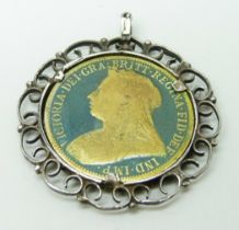 A mounted Victorian coin