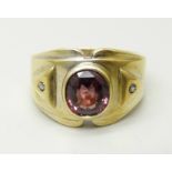 A gentleman's silver gilt and stone set ring, T