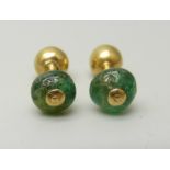 A pair of yellow metal and emerald earrings, with screw fitting