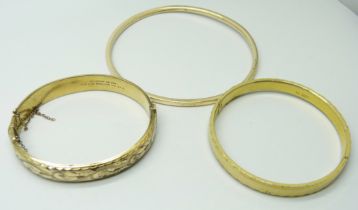Three vintage rolled gold bangles