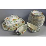 A hand painted Hancocks Ivory ware dinner service; soup dish, gravy boat, plates, side plates,