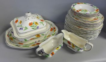 A hand painted Hancocks Ivory ware dinner service; soup dish, gravy boat, plates, side plates,