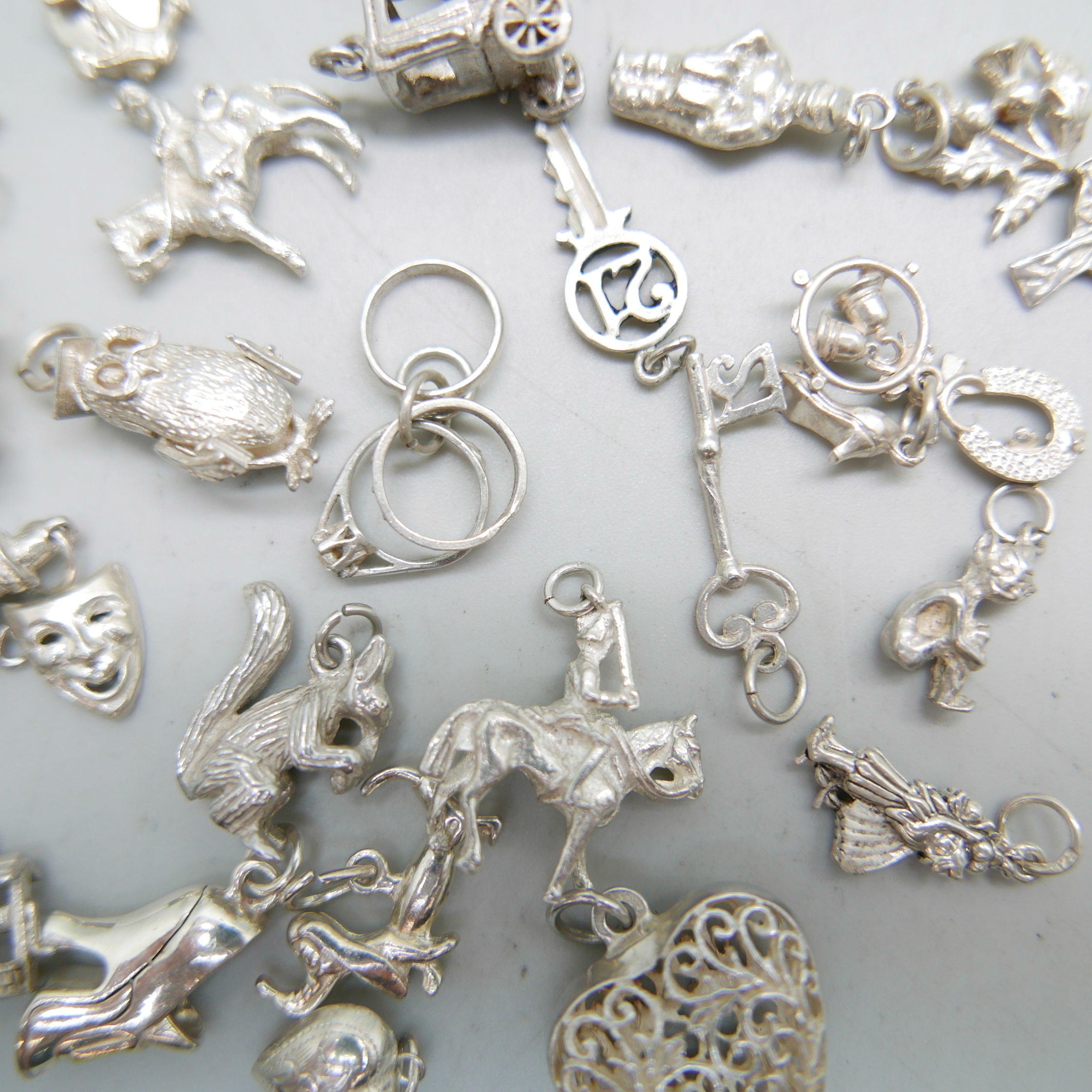 Twenty-four silver charms, 50g - Image 2 of 2
