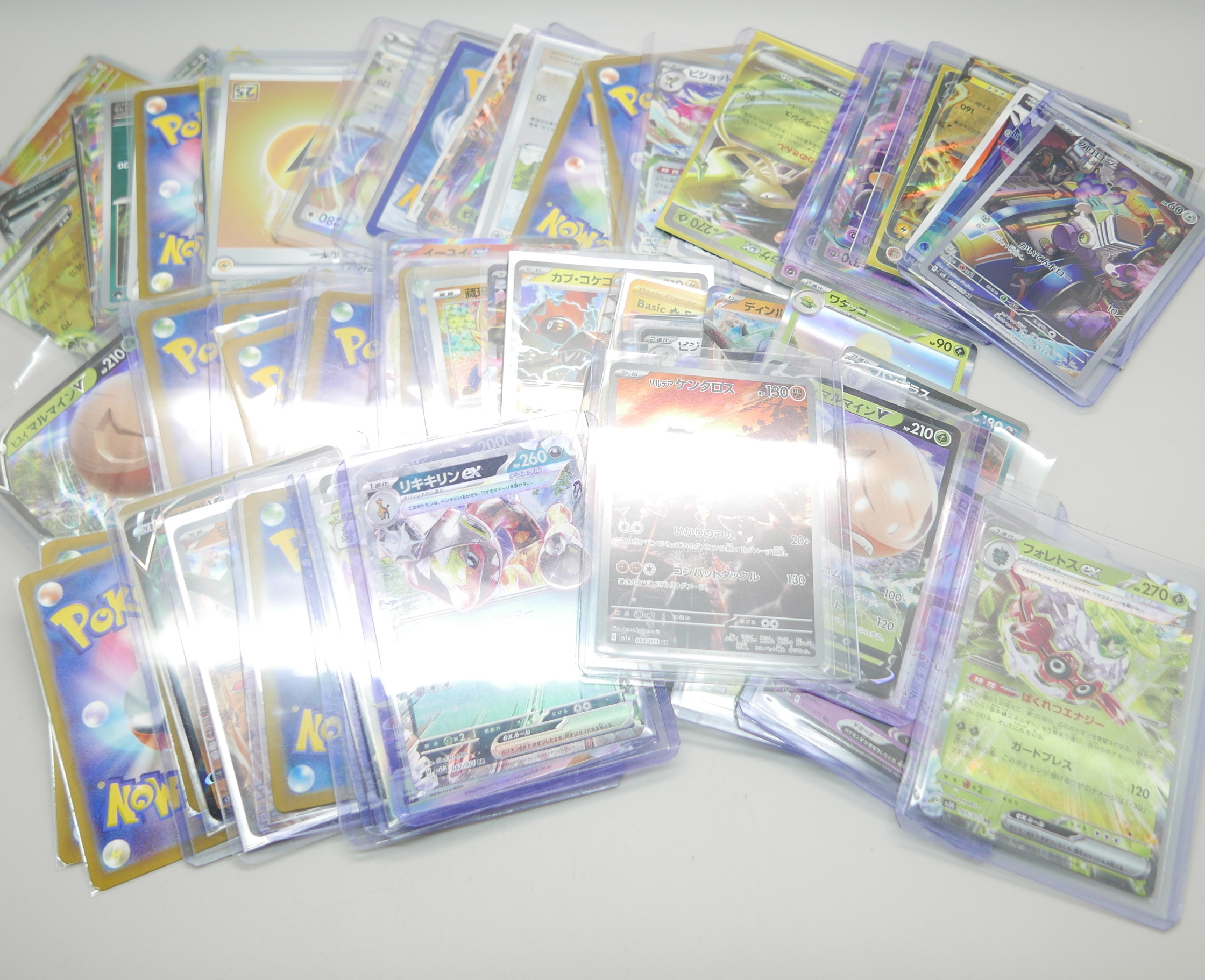 A collection of approximately 95 Pokemon cards