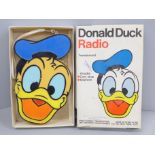 A Donald Duck transistor radio in original box, tested, not working