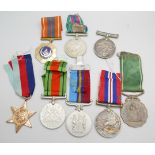 Eight medals, including two Africa Service Medals to 592810 D.T. Howells and 133965 C.W. Chapman