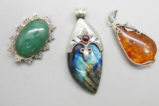 A Victorian silver and jade brooch, Birmingham 1884, a silver and amber pendant and a silver and