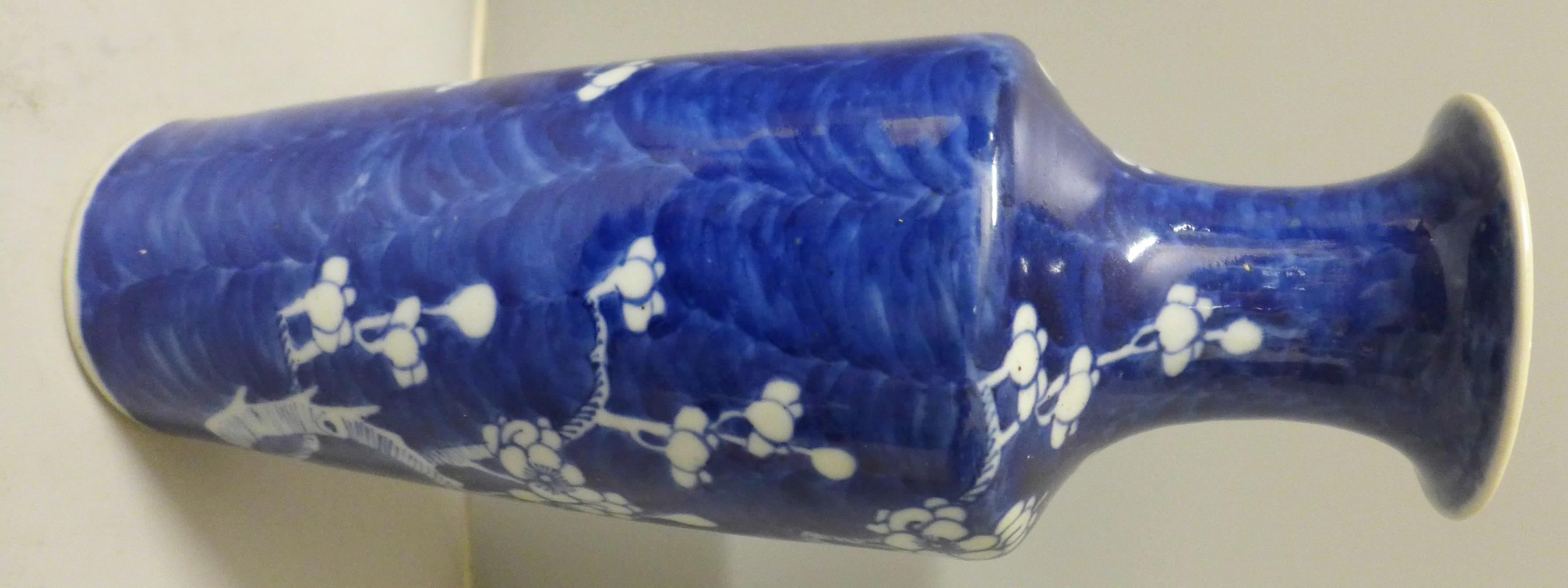 A blue and white Chinese vase with prunus decoration, four character mark to base, 30cm