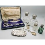 Two Victorian silver topped globular glass scent bottles, a silver dish with Reynolds Angels detail,